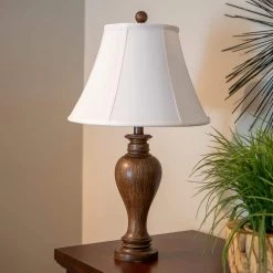 Truman 25 in. Dark Brown Resin Table Lamp by Decor Therapy -Decor Therapy Shop dark brown decor therapy table lamps tl22347 31 1000